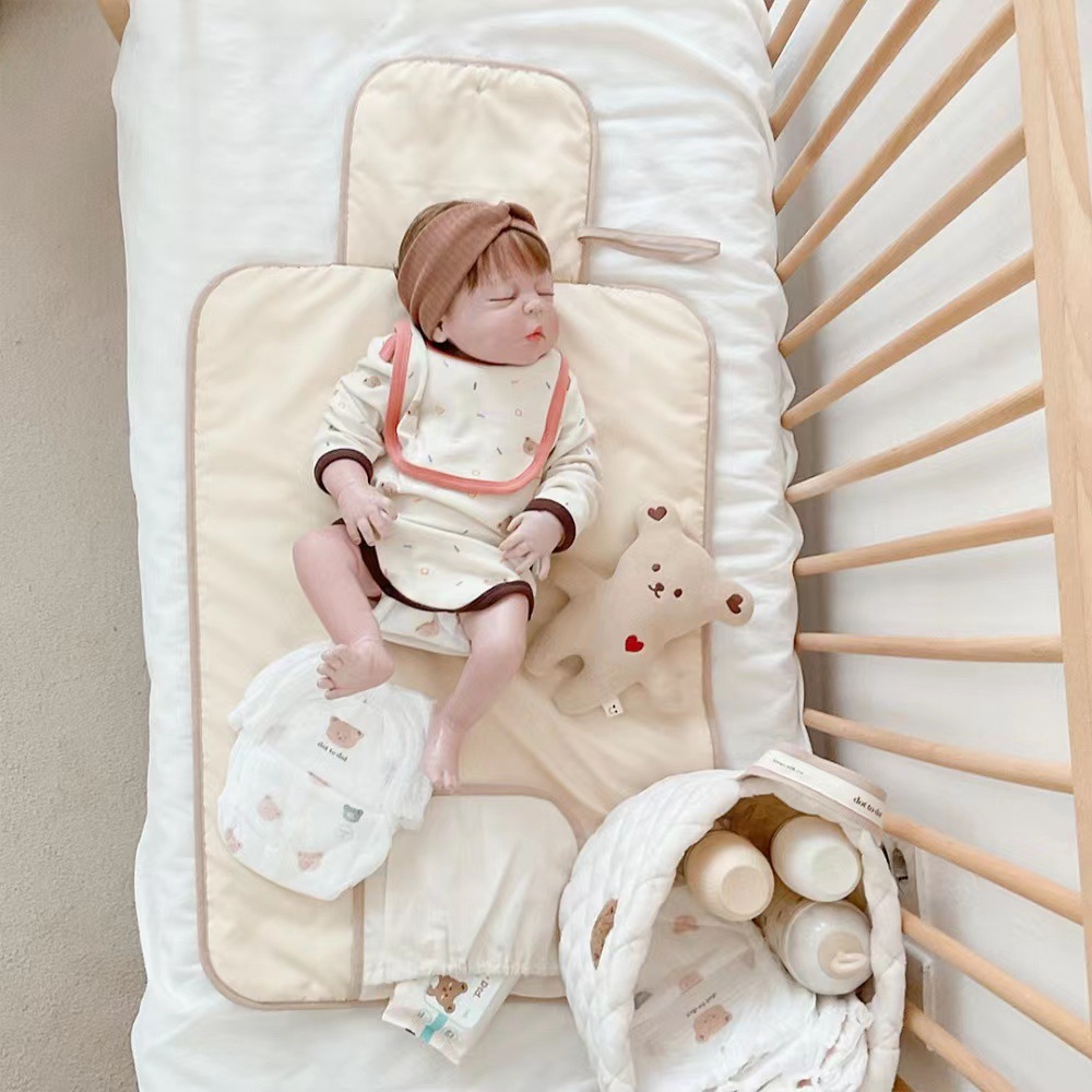 وسادة تغيير الحفاضات المحمولة  - مراجعة Changing Table Topper وسعره